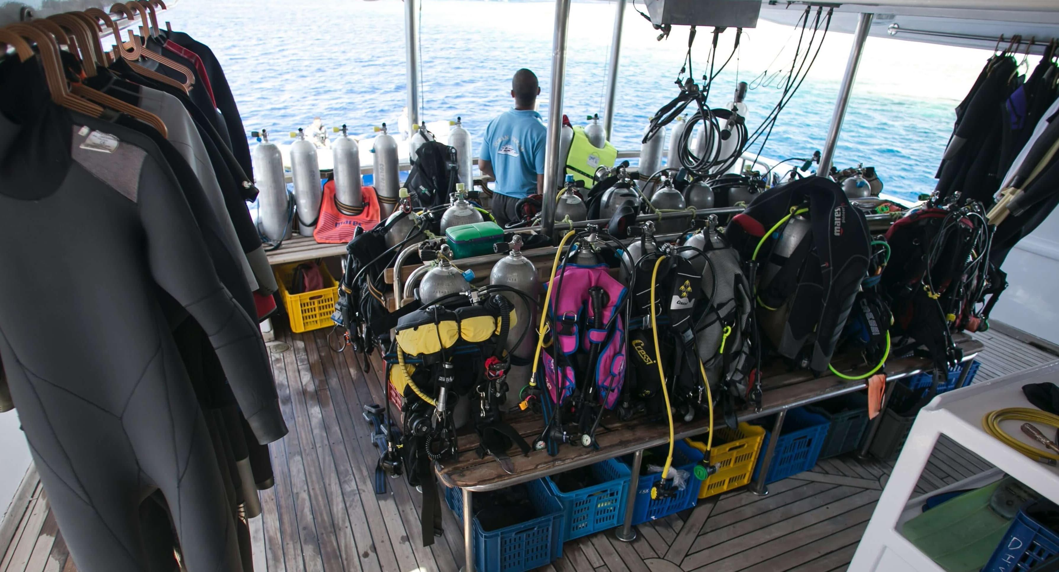 Dive shop gear and tanks prepared on a boat