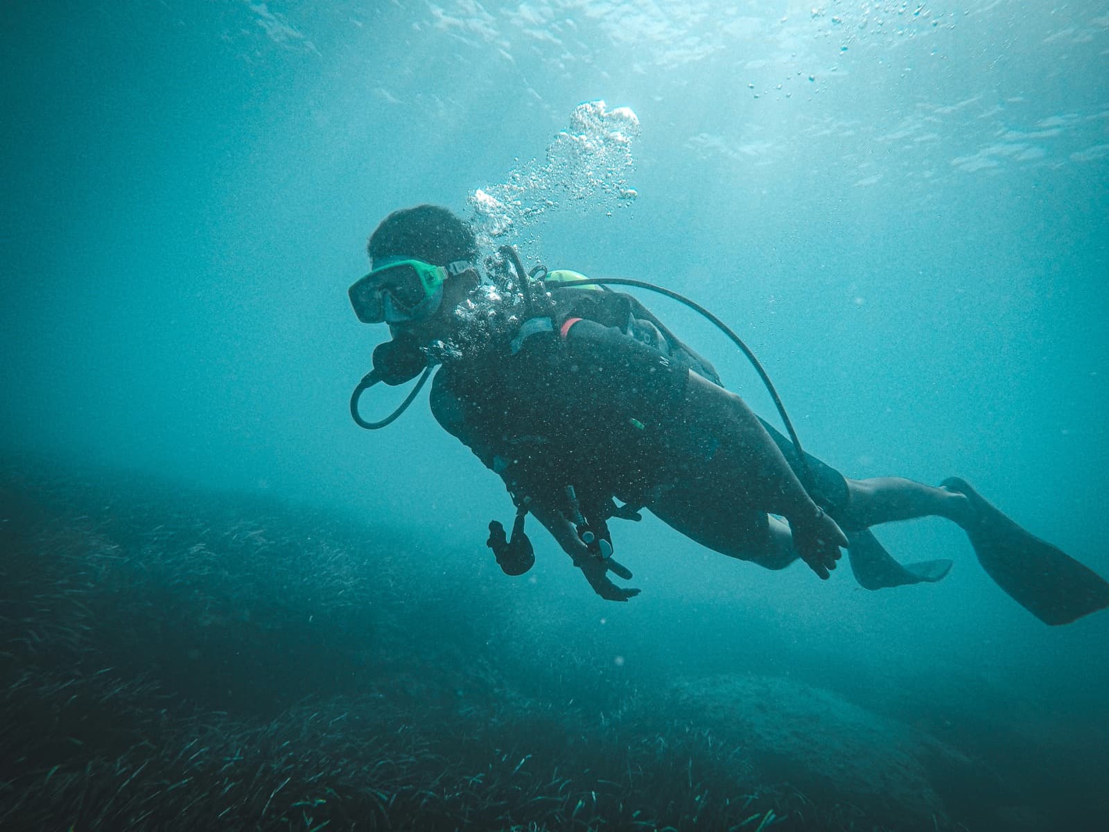 Scuba diver underwater for dive logging