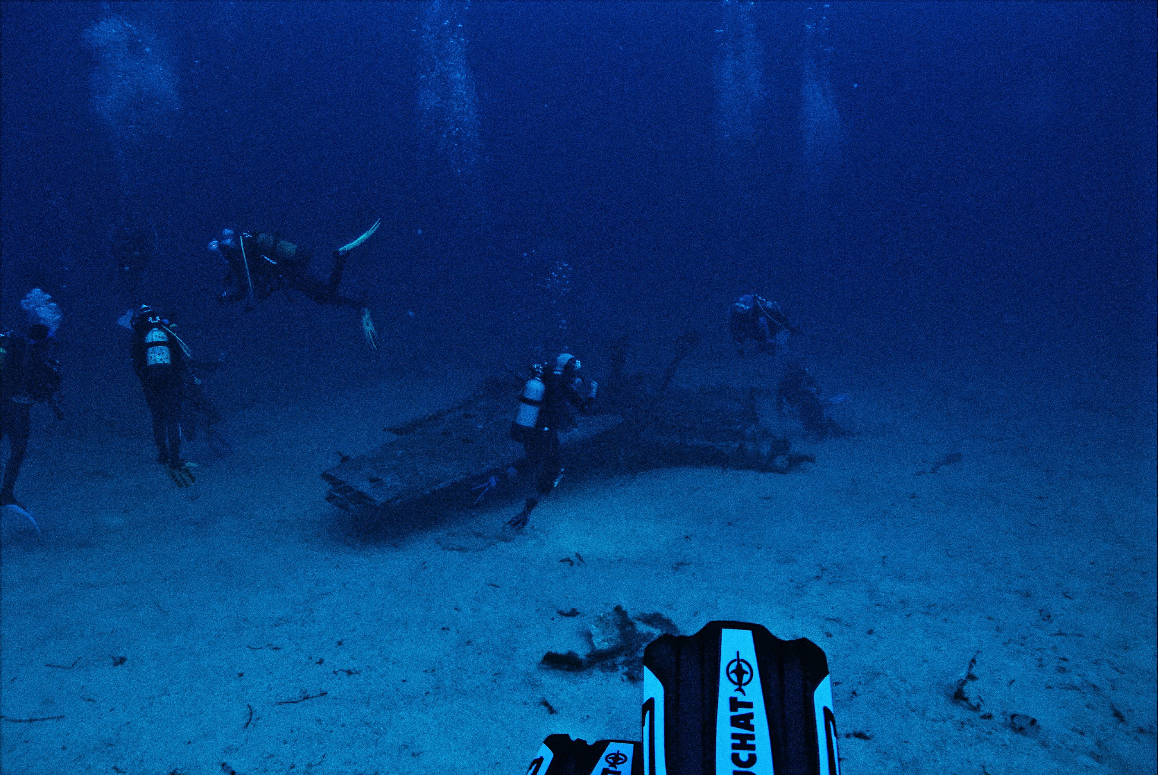 Divers connecting on a shared wreck dive